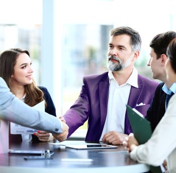 Business people shaking hands, finishing up a meeting